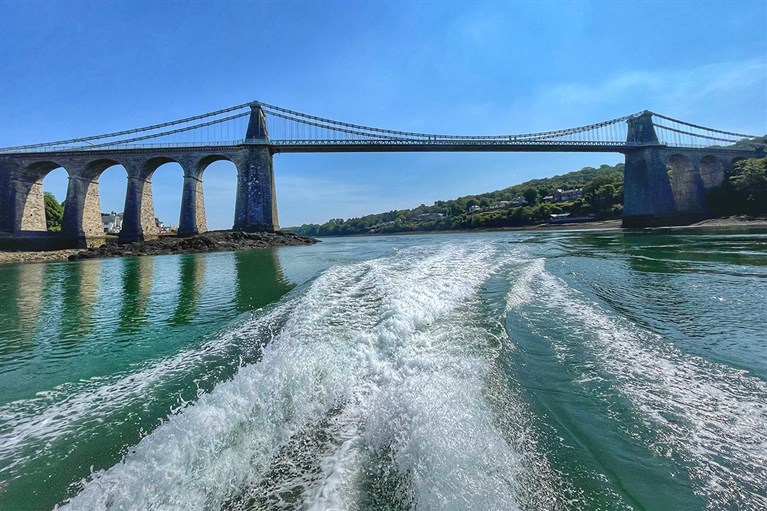 A dramatic view of Menai Bridge from one of our Anglesey boat trips